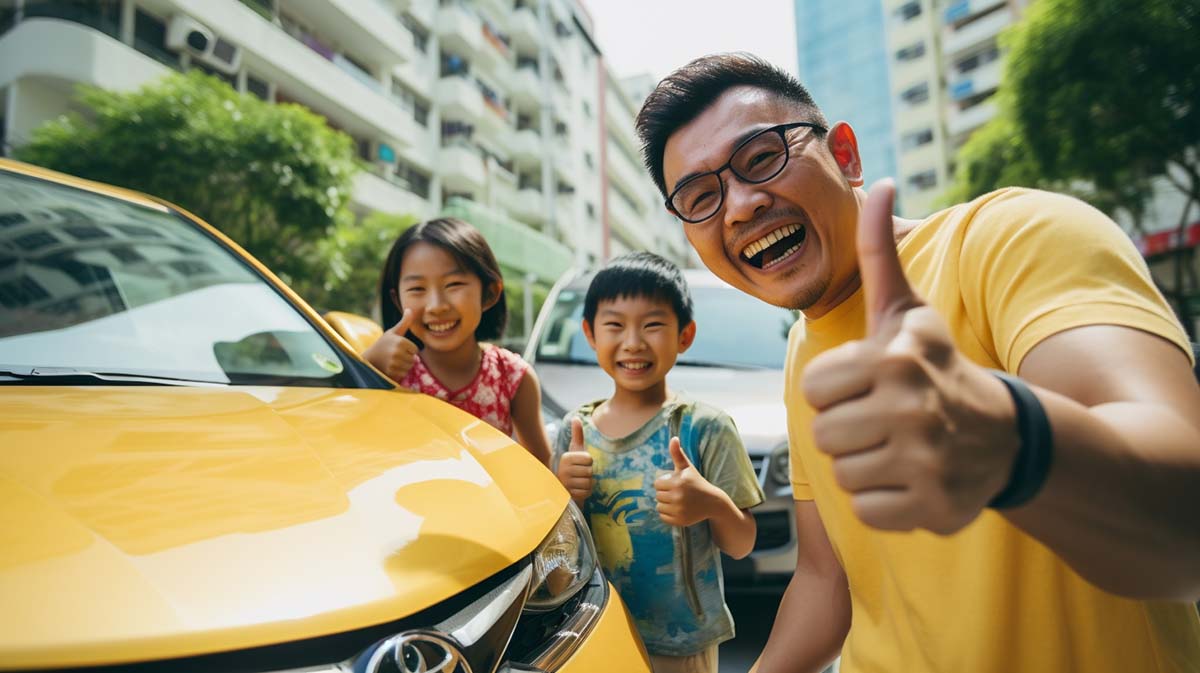 Yellow Bull Singapore Emergency Roadside Assistance A father, his daughter and son, all smiling and giving the thumbs up.
